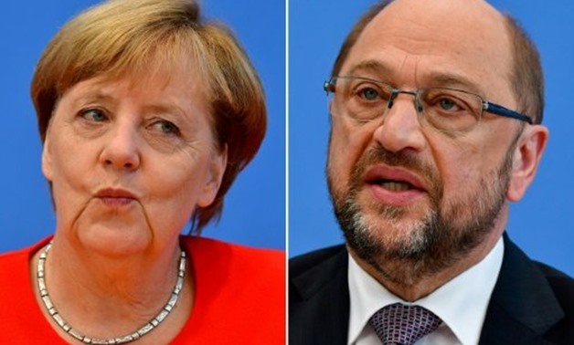 © AFP / by Hui Min NEO | German Chancellor Angela Merkel is expected to face a combative Martin Schulz at their one -- and only -- televised debate before the September 24 elections