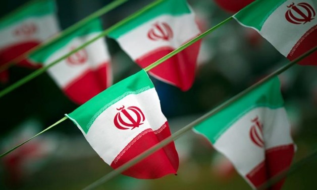 Iran's national flags are seen on a square in Tehran February 10, 2012. REUTERS