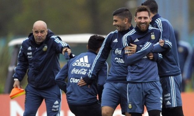 © AFP/File | Argentina's Lionel Messi (2nd R), Ever Banega (C) and Angel Di Maria joke around during a training session in Ezeiza, Buenos Aires, on September 3, 2017, ahead of their 2018 FIFA World Cup qualifier match against Venezuela
