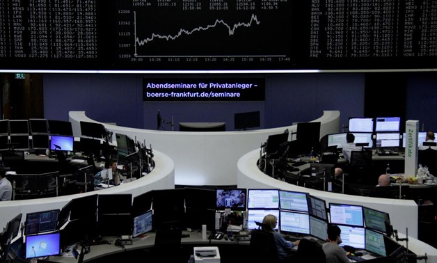Traders work in front of the German share price index, DAX board, at the stock exchange in Frankfurt, Germany, September 1, 2017. REUTERS/Staff/Remote