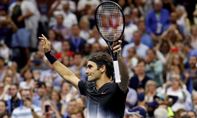 Roger Federer of Switzerland celebrates winning his fourth round match against Philipp Kohlschreiber of Germany– Press image Reuters