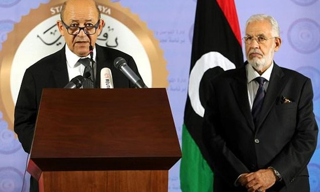 French Foreign Affairs Minister Jean-Yves Le Drian (L) gives a joint news conference in Tripoli with his Libyan counterpart Mohamed al-Taher Siala