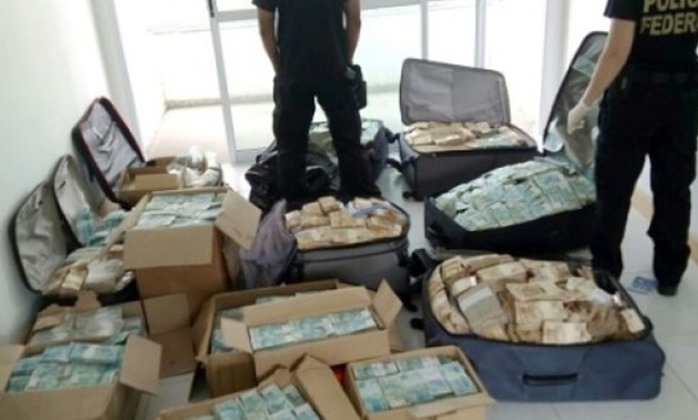 © Brazil's Federal Police/AFP | Bags and boxes with Brazilian currency real, seized in a flat used by former minister of President Michel Temer, Geddel Vieira Lima, seen in Salvador, Bahia state, on September 5, 2017

