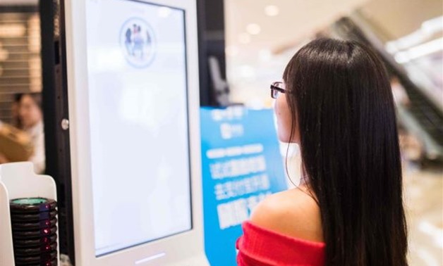 A Chinese customer experiencing a facial recognition payment system in Hangzhou. The operator of KFC in China is rolling out a futuristic system of paying at a fast-food counter via facial recognition, as the country embraces the technology for everything