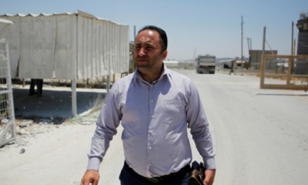 © AFP | Palestinian activist Issa Amro arrives for an Israeli military hearing near the West Bank city of Ramallah

