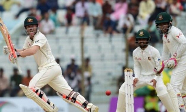 © AFP | Australian batsman David Warner (left) plays a shot during the second Test match against Bangladesh at Zahur Ahmed Chowdhury Stadium in Chittagong on September 5, 2017