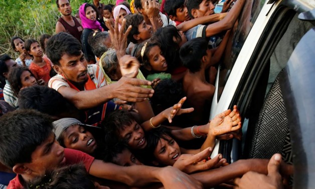  Rohingya refugees stretch their hands for food near Balukhali in Cox’s Bazar- Bangladesh- September 4 2017- REUTERS