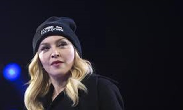 Singer Madonna walks on stage during Amnesty International's "Bringing Human Rights Home" concert in the Brooklyn borough of New YorkFebruary 5, 2014. REUTERS