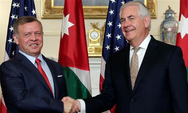 US Secretary of State Rex Tillerson (R) shakes hands with Jordanian King Abdullah II before their working luncheon at the State Department in Washington, DC, April 4, 2017 - REUTERS