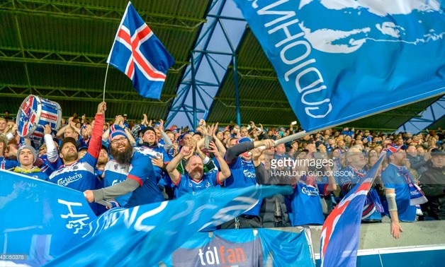 AFP/File | Icelandic football fans cheer their team during the FIFA World Cup 2018 qualification football match between Iceland and Ukraine in Reykjavik, Iceland on September 5, 2017