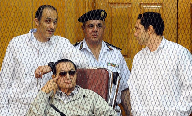 Gamal Mubarak (left), former President Mohamed Hosni Mubarak (middle) and Alaa Mubarak (right) - File photo 