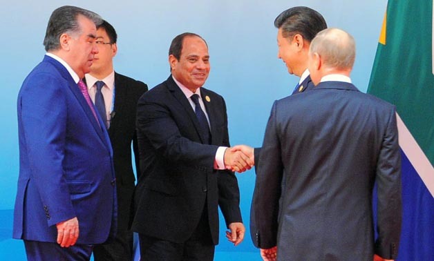 President Sisi shakes hand with his Chinese counterpart Xi Jinping at the Dialogue of Emerging Market and Developing Countries in Xiamen - Xinhua