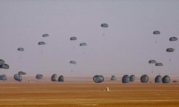  American and Egyptian paratroopers are air-dropped from a C-130 Hercules aircraft during exercise Bright Star 2007, at Kum Oshim 90 km (56 miles) south of Cairo, Egypt November 8, 2007 - REUTERS/Nasser/File Photo