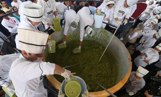 Volunteers from a culinary school mix mashed avocados as they attempt to set a new Guinness World Record for the largest serving of guacamole in Concepcion de Buenos Aires, Jalisco, Mexico September 3, 2017. REUTERS/Fernando Carranza
