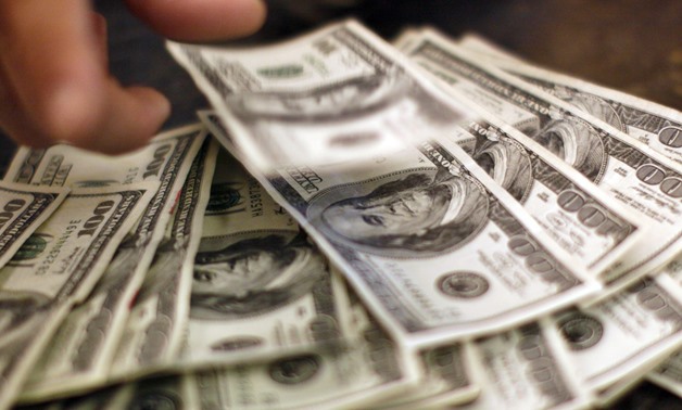  U.S. Dollar Bills by Reuters-Rick Wilking