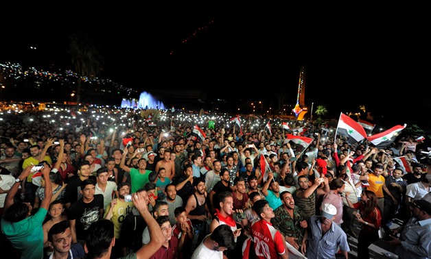 Syria Football fans watch the match against Iran - Reuters