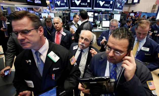 Traders work on the floor of the New York Stock Exchange (NYSE) in New York City, U.S., November 29, 2016. REUTERS/Brendan McDermid