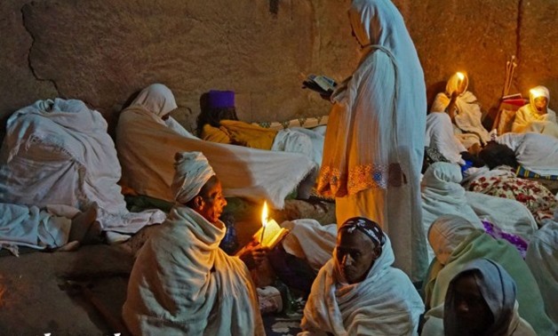 Thousands of pilgrims spend the whole night of Christmas chanting, praying and reading holy books in the medieval, rock-hewn churches of Lalibela.