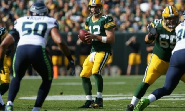 GETTY/AFP | Aaron Rodgers of the Green Bay Packers looks to pass during the first half against the Seattle Seahawks, at Lambeau Field in Green Bay, Wisconsin, on September 10, 2017