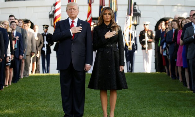 U.S. President Donald Trump and first lady Melania Trump observe a moment of silence in remembrance of those lost in the 9/11 attacks at the White House in Washington, U.S. September 11, 2017. REUTERS/Kevin Lamarque

