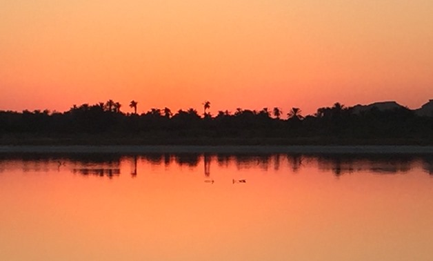 Sunset reflection on the salt lake in Maraqi, Siwa Oasis – Monika Sleszynska