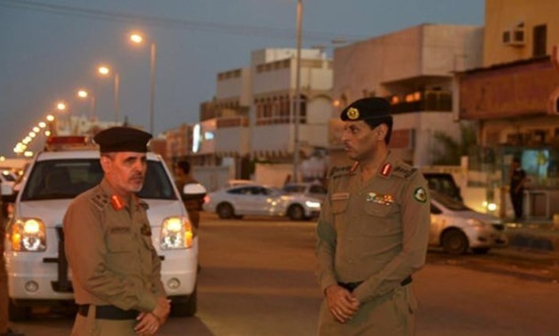 Members of Saudi security forces stand guard in the port city of Jazan - Reuters
