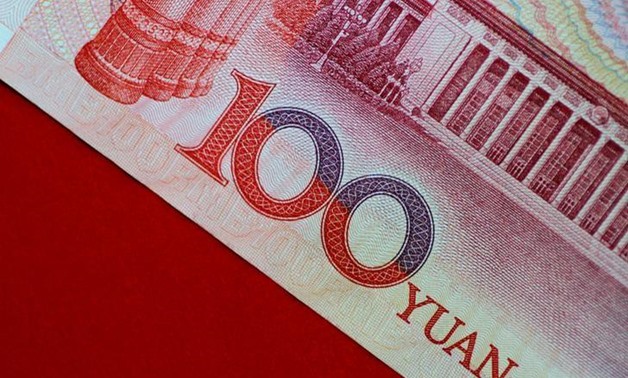 FILE PHOTO: A China yuan note is seen in this illustration photo May 31, 2017. To match Analysis CHINA-YUAN/ REUTERS/Thomas White/Illustration/File Photo