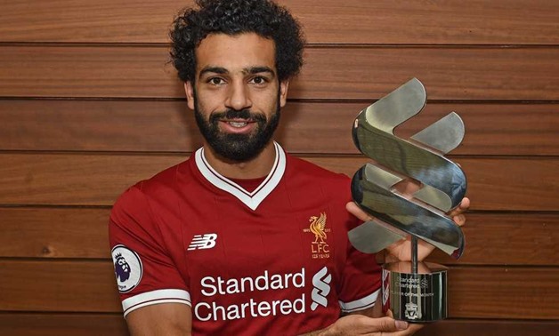 Mohamed Salah with the trophy, Liverpool`s official website