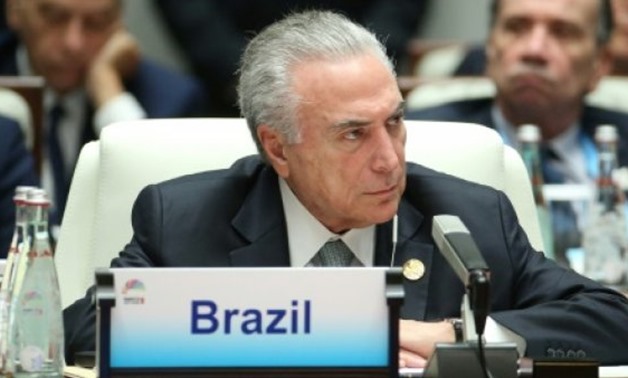 Brazil's President Michel Temer, pictured in this September 5 file photo, lambasted prosecutors' use of wire taps and plea deal testimony from businessmen and politicians admitting to corruption