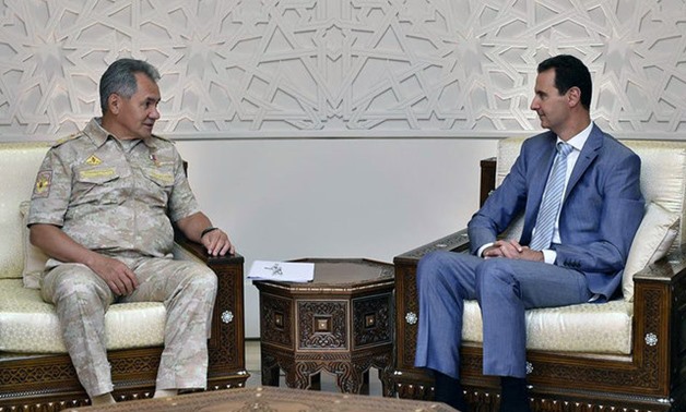 Russian Defence Minister Sergei Shoigu meets with Syrian President Bashar al-Assad in Damascus - REUTERS
