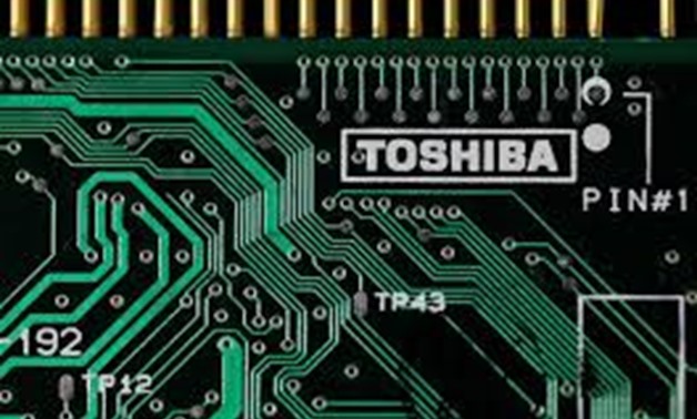 FILE PHOTO: A logo of Toshiba Corp is seen on a printed circuit board in this photo illustration taken in Tokyo July 31, 2012. REUTERS/Yuriko Nakao/Illustration/File Photo