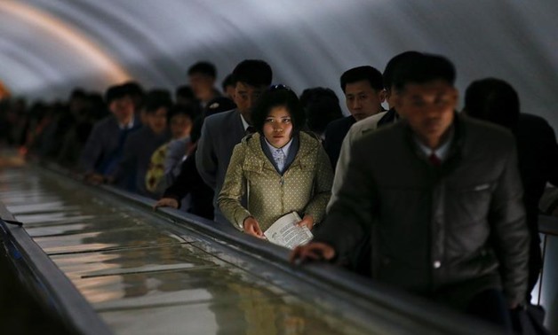 FILE PHOTO: People travel on escalators to exit a subway station in central Pyongyang, North Korea April 14, 2017. REUTERS/Damir Sagolj
