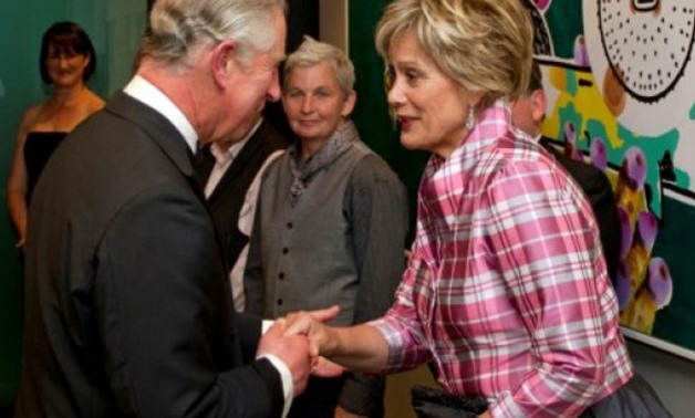 © POOL/AFP/File | Britains's Prince Charles meets Dame Kiri Te Kanawa at a reception in Auckland in 2012