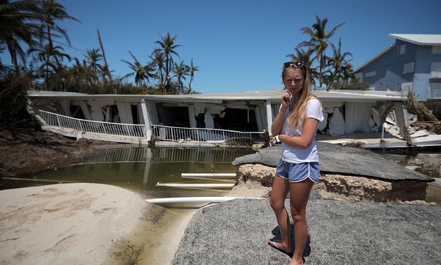 A local resident reacts as she sees the damage on her home after Hurricane Irma struck Florida, in Islamorada Key, U.S., September 12, 2017. REUTERS/Carlos Barria