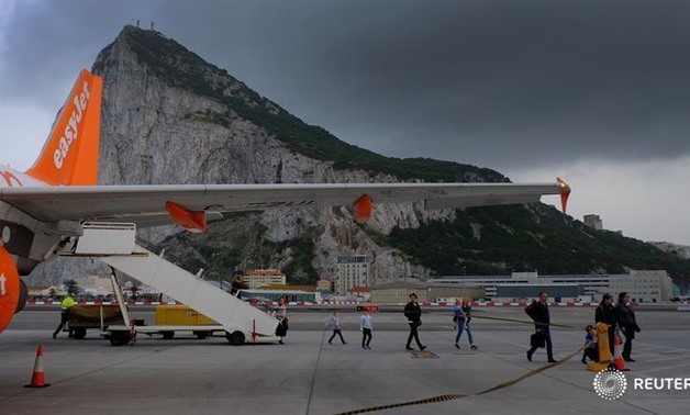Passengers disembark from an EasyJet flight after arriving at Gibraltar airport in Gibraltar, April 19, 2017. REUTERS/Phil Noble