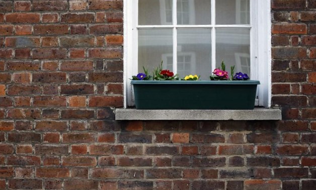 FILE PHOTO - Flowers are seen outside a house in central London, Britain January 19, 2017. REUTERS/Stefan Wermuth