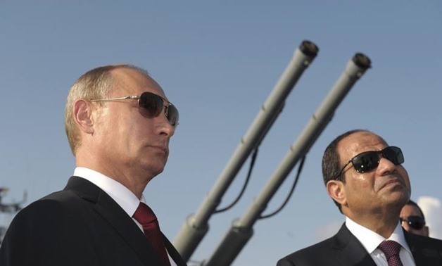 Russia's President Vladimir Putin (L) and his Egyptian counterpart Abdel Fattah al-Sisi attend a welcoming ceremony onboard guided missile cruiser Moskva at the Black Sea port of Sochi, in this file photo taken on August 12, 2014. REUTERS/Alexei Druzhinin