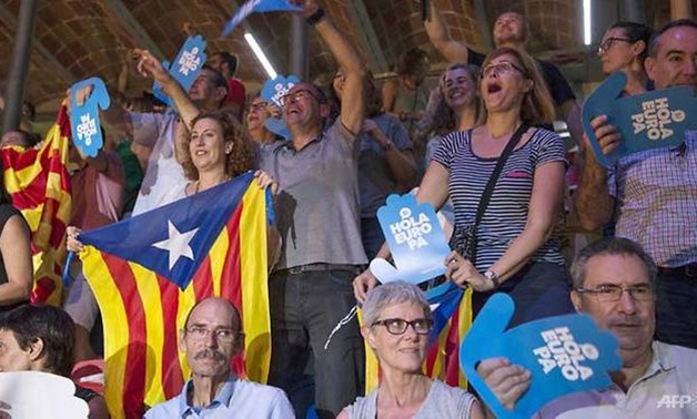 People cheer as they attend the official launch of Catalonia's main separatist parties' campaign for an independence referendum at the Tarraco arena in Tarragona. (Josep LAGO/AFP)