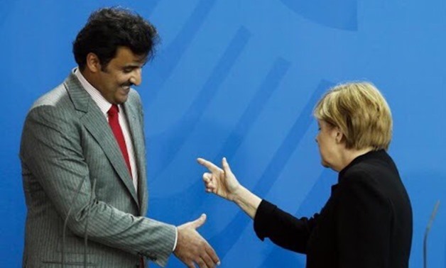 German Chancellor Angela Merkel (R) and Qatar's ruler Emir Sheikh Tamim bin Hamad al-Thani in Berlin, September 17, 2014- Reuters