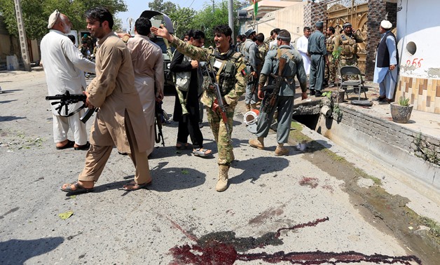 ATTENTION EDITORS - VISUAL COVERAGE OF SCENES OF INJURY OR DEATH Afghan security force stand at the site of a suicide attack in Jalalabad city, Afghanistan August 30, 2017. REUTERS/Parwiz TEMPLATE OUT

