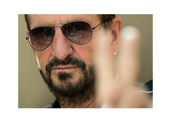 British musician and former Beatles member Ringo Starr poses for a photograph after speaking to the press to promote his new album 'Give More Love'