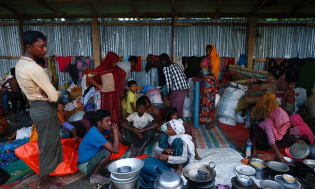 Rohingya refugees go about their day inside their temporary shelter near Balukhali in Cox's Bazar, Bangladesh, September 13, 2017. REUTERS/Danish Siddiqui
