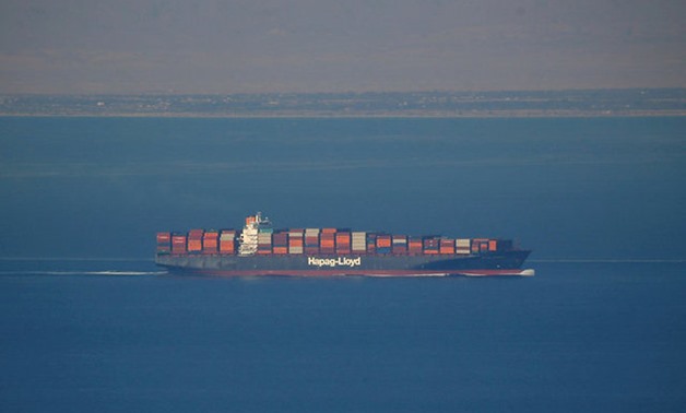 FILE PHOTO: A Hapag Lloyd container ship sails across the Gulf of Suez towards the Red Sea before entering the Suez Canal, in El Ain El Sokhna in Suez, east of Cairo, Egypt April 24, 2017. REUTERS/Amr Abdallah Dalsh/File Photo GLOBAL BUSINESS WEEK AHEAD S