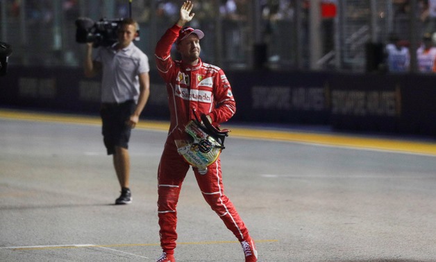 Formula One F1 - Singapore Grand Prix 2017 - Singapore - September 16, 2017 Ferrari's Sebastian Vettel celebrates getting pole position in qualifying REUTERS/Edgar