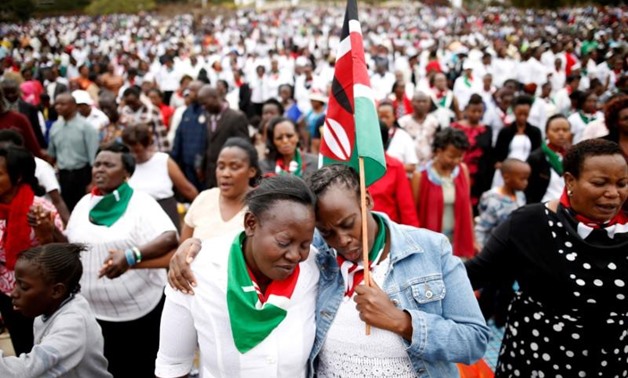 Kenyans pray during a rally calling for peace ahead of Kenya's August 8 election in Nairobi, Kenya. REUTERS/Baz Ratner.
