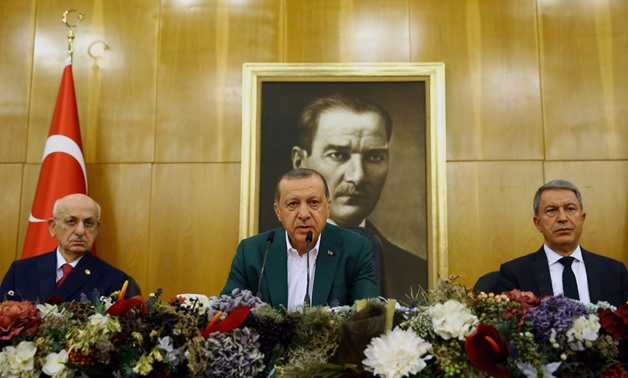 Turkish President Tayyip Erdogan, accompanied by Parliament Speaker Ismail Kahraman and Chief of Staff, General Hulusi Akar, speaks during a news conference at Ataturk airport in Istanbul, Turkey, September 17, 2017. Kayhan Ozer/Presidential Palace/Handou