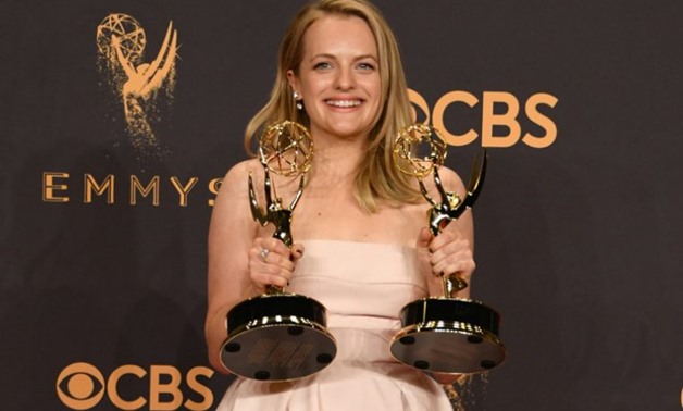 Elisabeth Moss poses with the awards for Outstanding Drama Series and Outstanding Lead Actress in a Drama Series for "The Handmaid's Tale" during the 69th Emmy Awards on September 17, 2017 in Los Angeles