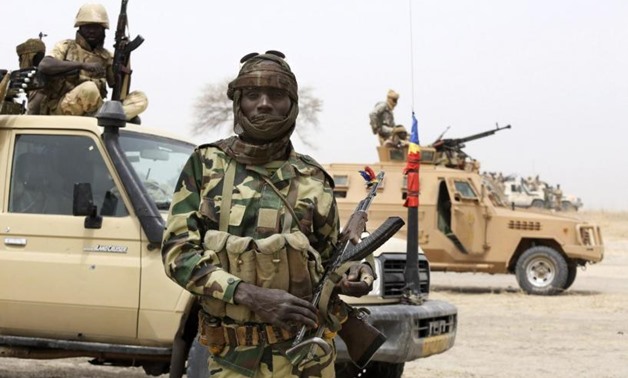 A Chadian soldier poses for a picture at the front line during battle against insurgent group Boko Haram in Gambaru, February 26, 2015. REUTERS