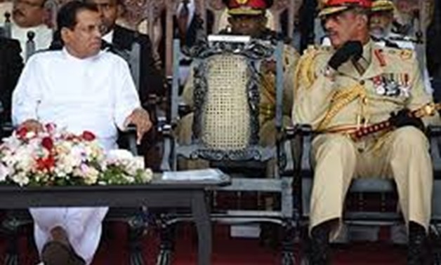 © AFP/File | Sri Lanka's President Maithripala Sirisena (L) and first Field Marshal Sarath Fonseka (R) look on during a commemorative ceremony in Colombo on May 19, 2017, marking the eight anniversary of the end of the islands Tamil separatist war