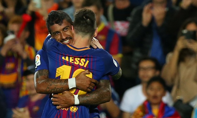 Paulinho and Lionel Messi, Reuters